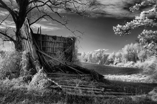 Infrared black/white barn near Cameron, NC, falling down next to a freshly plowed field