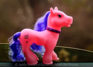 Yes, there are pink ponies with purple hair that sparkle with magic.